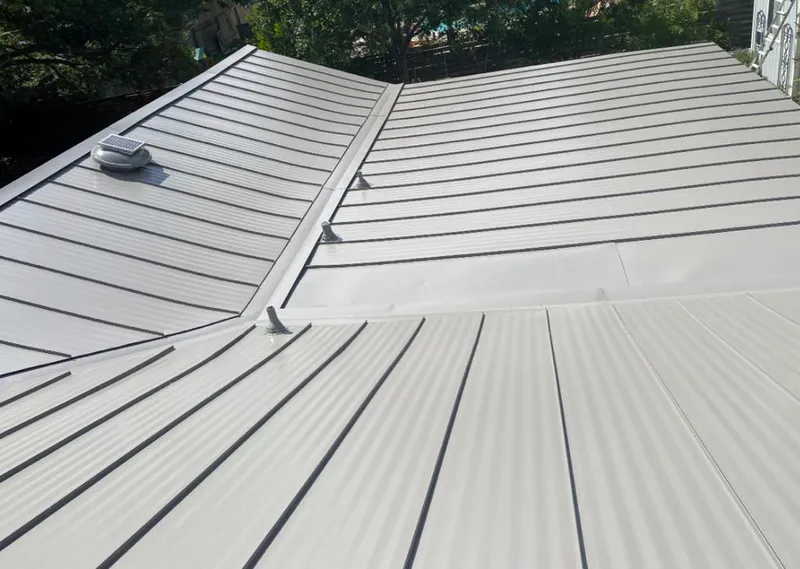 Solar attic fan installed on a metal roof for Roof Ventilation in Hot Springs